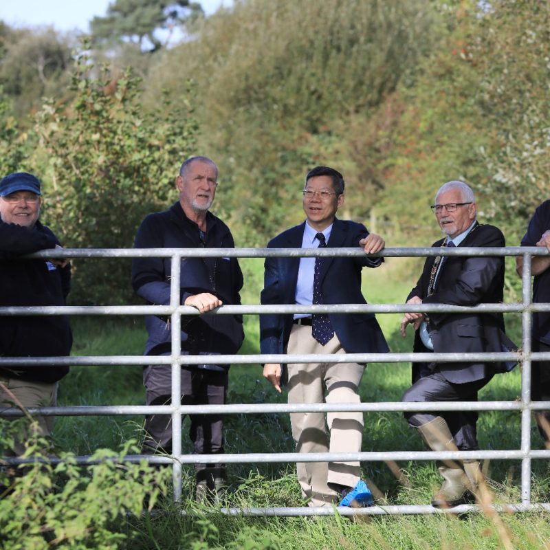 Chinese Consul General Li Nan visits a Lough Neagh catchment farm with representatives of Lough Neagh Partnership and the Mayor of Antrim and Newtownabbey.