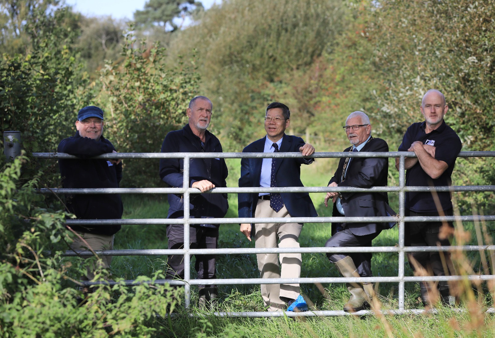 Chinese Consul General Li Nan visits a Lough Neagh catchment farm with representatives of Lough Neagh Partnership and the Mayor of Antrim and Newtownabbey.